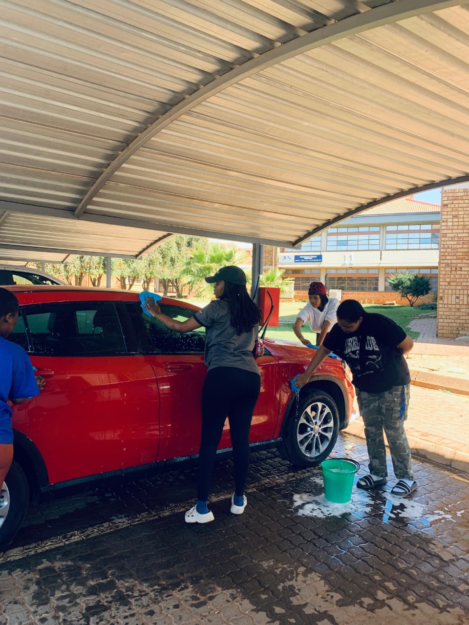 EEA members washing cars to raise funds for the Jericho trip